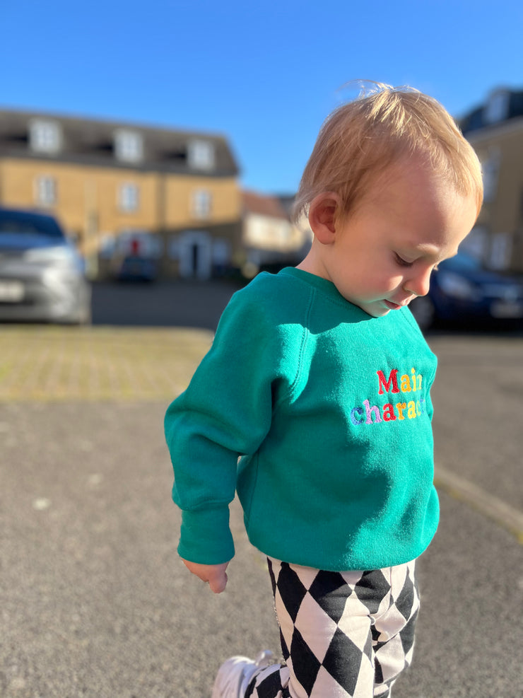 Embroidered Main Character rainbow Kids emerald sweater